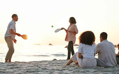 Image showing Beach, ping pong and family on a summer vacation, adventure or weekend trip in Australia. Travel, fun and people playing a sports game on the sand by the ocean while on a seaside holiday together.