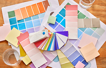 Image showing Color palette paper on table for background in design choice, branding and creativity career, project or planning. Colorful charts, sticky note and print paper for creative or brand development above