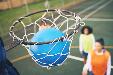 Image showing Ball in net, netball and sports outdoor with team, fitness and active lifestyle with athlete on court. Sport, professional club and people playing game, success with goal and exercise with training