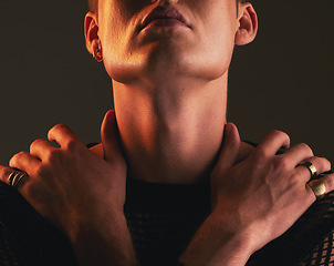 Image showing Man, self love and hug in studio on a dark background for fashion, lgbt inclusion or gay pride. Hands, hugging and holding with a homosexual or androgynous male standing alone for body positivity