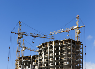 Image showing tall yellow construction crane