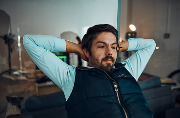 Image showing Relax, break and man in an office for work, success and working at night for a deadline. Looking, corporate and businessman with stress relief, relaxed and overtime in the workplace in the dark
