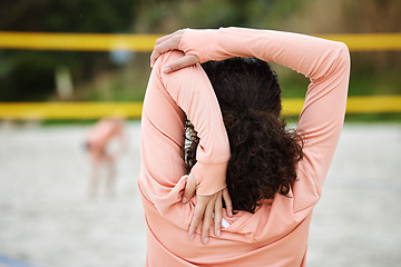 Image showing Back, stretching arm and woman at beach for volleyball practice, training or workout. Exercise, sports fitness and female athlete warm up, prepare or get ready to start match, game or competition.