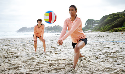 Image showing Volleyball, sports and teamwork of women at beach hitting ball in competition, game or match mockup. Training, exercise and girls, players or friends play for workout, fitness and health at seashore.