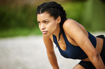 Image showing Beach, fitness and focus with a woman runner breathing while outdoor for cardio or endurance training. Exercise, tired or rest and a female athlete taking a break from running on the sand with mockup