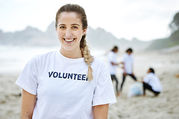 Image showing Smile, volunteer portrait and woman at beach for cleaning, recycling or environmental sustainability. Earth day, happy face and proud female for community service, charity and climate change at ocean