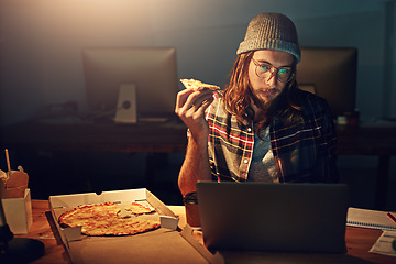 Image showing Web designer, man with pizza at laptop and night shift, overtime and deadline at digital marketing agency. Content research, reading and serious male at desk, working late at startup eating fast food