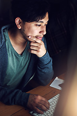 Image showing Web designer, Asian man at desk and thinking during night shift, overtime and deadline at digital marketing agency. Content research, reading and serious male, working late at startup and typing