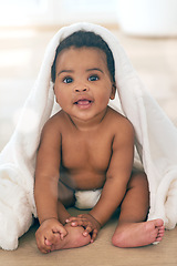 Image showing Adorable baby, black child and blanket for play, fun and newborn on nursery room floor, happiness and relax. Happy young infant kids, girl and smile of healthy development, growth or smiling in house