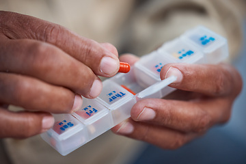 Image showing Medicine, container and hands of old person with pills for organize, healthcare and prescription. Medical, pharmacy and wellness with senior citizen and medication for vitamins, antibiotics and drugs