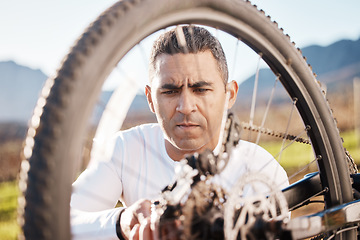 Image showing Cycling, repair and wheel with man in nature for sports, wellness and fitness training. Adventure, safety and tire change with cyclist fixing mountain bike on trail for broken, puncture and check