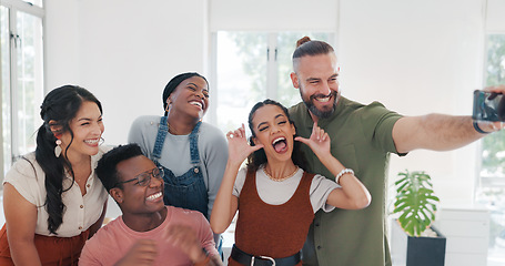 Image showing Group selfie, hand gesture and business people in office taking pictures for social media. Comic face, blowing kiss and friends, men and women with peace sign taking photo together for happy memory.