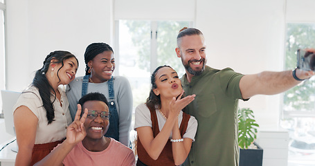 Image showing Group selfie, hand gesture and business people in office taking pictures for social media. Comic face, blowing kiss and friends, men and women with peace sign taking photo together for happy memory.