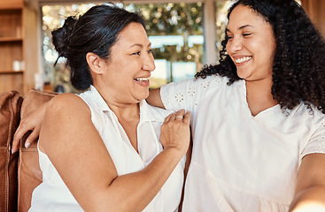 Image showing Woman, senior mother and smile of family on a living room sofa with happiness and bonding. Mama love, support and happy elderly care with women on a lounge couch in a house together with a hug