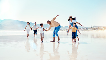 Image showing Family, beach and parents play with children for bonding, quality time and adventure together. Travel, freedom and happy mom, dad and kids enjoy summer holiday, vacation and relax on weekend by sea