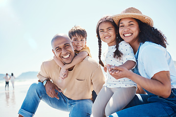 Image showing Family, portrait and smile at beach on vacation, having fun and bonding together. Holiday, relax and care of happy father, mother and kids or children by seashore enjoying quality time outdoors.