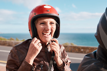 Image showing Summer, senior woman and helmet on road, happiness and quality time on break, relax and vacation. Mature female, old lady and safety for motor bike ride, smile and cheerful on holiday and joyful