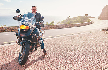 Image showing Motorbike, mountain and portrait of man for road, countryside or coastal travel outdoor adventure or sports. Professional driver or mature male in motorcycle transport parking alone on asphalt street