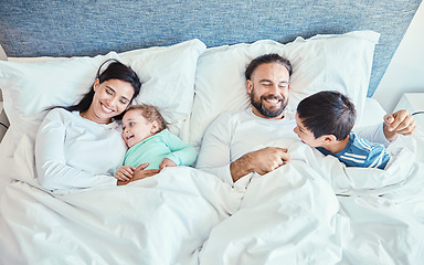 Image showing Morning, relax and happy with family in bedroom for wakeup, affectionate and bonding from top view. Smile, care and sleeping with parents and children in bed at home for playful, happiness or support