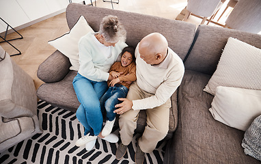 Image showing Relax, playful and child with grandparents on sofa of living room for bonding, affectionate and embrace. Support, care and break with senior people and boy at home for happiness, generations and hug