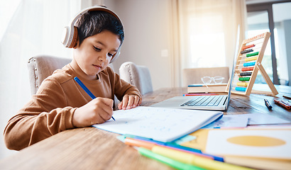 Image showing Learning headphones, math education and kid in home with book for studying, homework or homeschool. Development, laptop or boy or child with notebook for numbers in elearning, virtual or online class