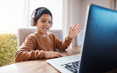 Image showing Elearning, wave and kid on laptop video call with headphones for education or studying. Development, growth and happy boy waving on computer for greeting in virtual or online class for homeschool.