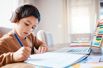 Image showing Learning headphones, math education and child in home with book for studying, homework or homeschool. Development, laptop or boy or kid with notebook for numbers in elearning, virtual or online class