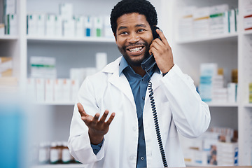 Image showing Pharmacist, black man or phone call in patient help, customer consulting or telehealth medicine service in drugstore. Smile, happy or talking pharmacy worker on telephone in healthcare product advice
