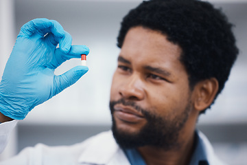 Image showing Black man, pharmacist or holding medicine in research, medical healthcare or wellness innovation in laboratory clinic or hospital study. Pharmacy, worker or employee with pills drugs or product help