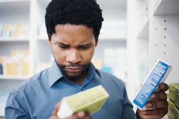 Image showing Black man, pharmacy stock check and pharmacist in a wellness, healthcare and drugs clinic. Reading, medical information and a retail pharmaceutical worker with pills storage and store supplements