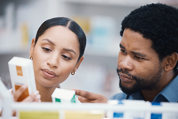 Image showing Pharmacist, worker and helping patient with medicine information, pills instructions or medical consulting in store. Pharmacy woman, black man and customer with retail drugs or healthcare product box