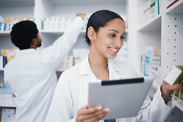 Image showing Pharmacist, woman or digital tablet for medicine check, stock take or medical research in drugs store. Smile, happy or pharmacy worker on technology for pills, checklist or ecommerce healthcare order