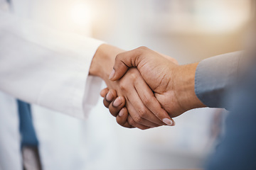 Image showing Doctor, patient and handshake in hospital thank you, welcome or greeting for medicine trust, help or medical consulting. Zoom, black man and shaking hands with pharmacy worker or healthcare employee