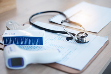 Image showing Covid thermometer, doctor data and hospital survey with stethoscope and no people in clinic. Healthcare, wellness and medical paperwork and contract for corona security and health care support