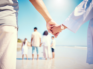 Image showing Walk, support and a child and mother holding hands at the beach for trust, love and care in Spain. Family, together and mom and kid with affection at the ocean while walking during a holiday