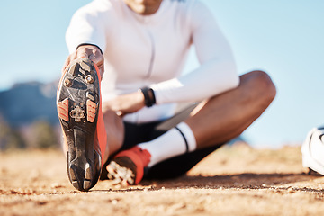 Image showing Fitness, stretching and sports with shoes of man in nature for travel, cycling and cardio training. Practice, relax and start with athlete and warm up on trail for exercise, workout and commitment