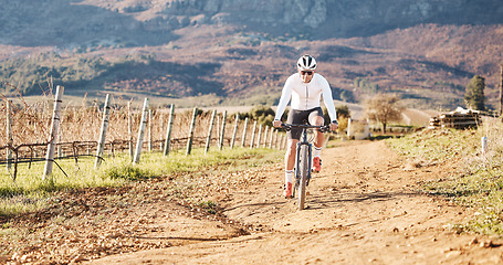 Image showing Man, mountain bike and cycling on path in nature, countryside and training for triathlon, sports and race. Cyclist, bicycle and off road trail for marathon fitness, exercise and freedom in sunshine