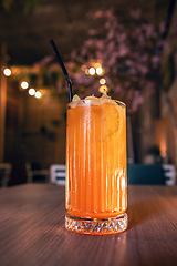 Image showing Glass of orange cocktail