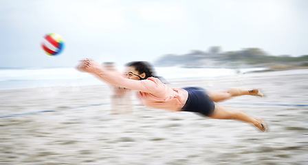 Image showing Beach volleyball, diving or sports woman playing a game in training or workout in summer together. Team fitness, dive action or active girl on sand in a fun competitive match in Sao Paulo, Brazil