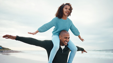 Image showing Love, father carry girl and beach for quality time, happiness and carefree together, loving and bonding. Family, dad and daughter on shoulders, smile or freedom on seaside holiday, vacation and relax