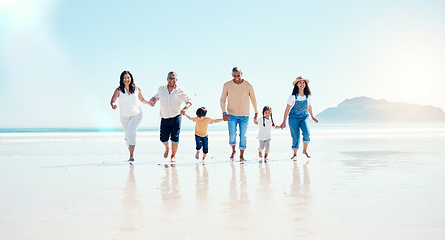 Image showing Beach, walking and mockup with a black family holding hands outdoor in nature by the ocean at sunset together. Nature, love or kids with grandparents, parents and children taking a walk on the coast