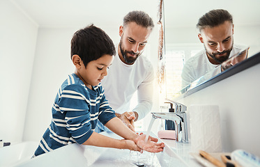 Image showing Cleaning hands, washing and father with boy in bathroom for hygiene, wellness and healthcare at home. Family, skincare and dad with child learning to wash with water, soap and disinfection by faucet