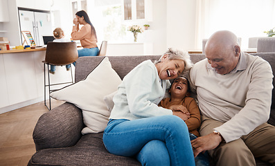 Image showing Laughing, happy and grandparents babysitting a child, bonding and being funny on the sofa. Smile, comic and boy kid speaking to a senior man and woman on the living room couch for quality time