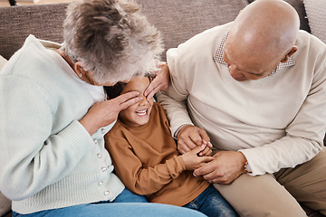 Image showing Love, grandparents and boy play on couch, happiness and bonding together for quality time. Family, granny and grandad with grandchild, playing and smile in living room, loving and enjoy retirement