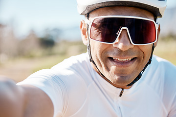 Image showing Selfie, portrait and man in nature for cycling, sports memory and enjoying a ride in the countryside. Smile, fitness and face of a biker taking a photo while riding in France for a race or triathlon