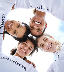 Image showing Portrait, huddle and women volunteering in nature for community, earth day and cleanup project. Smile, below and a group of volunteers with support, collaboration and helping for charity service