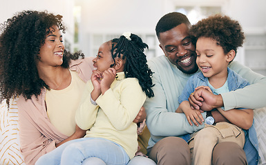 Image showing Happy, love and black family bonding on the sofa together in the living room of their modern home. Happiness, smile and African children having fun with parents while sitting on the couch at house.