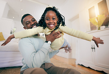 Image showing Black man, father and daughter with plane game, happiness and smile for love, bonding and care on bedroom floor. Happy family home, airplane games and dad with holding, balance and happy with playing