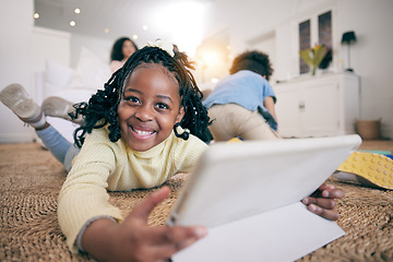 Image showing Relax, smile and portrait of black girl and tablet on floor of living room for elearning, streaming or education app. Technology, happy or internet with child browsing online at home for digital game