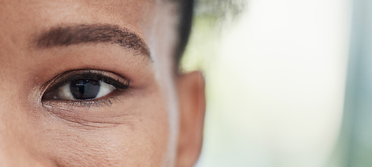 Image showing Eye focus, vision zoom and mockup of a black woman outdoor with blurred background. Eyes closeup, portrait and health care for optometry and eyesight check with a young African female with mock up